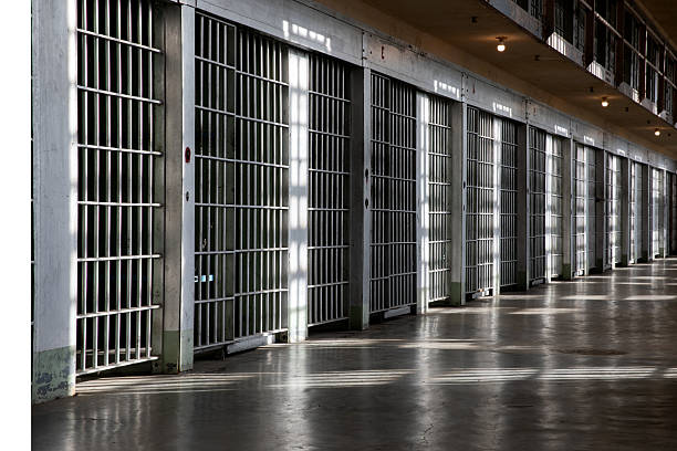 istock A long hallway with many bars on the windows 2242508347