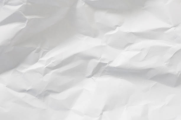 istock A dramatic collection of crumpled paper sheets in monochrome, highlighting the stark interplay of deep shadows, bright highlights, and intricate abstract textures. 2242508509