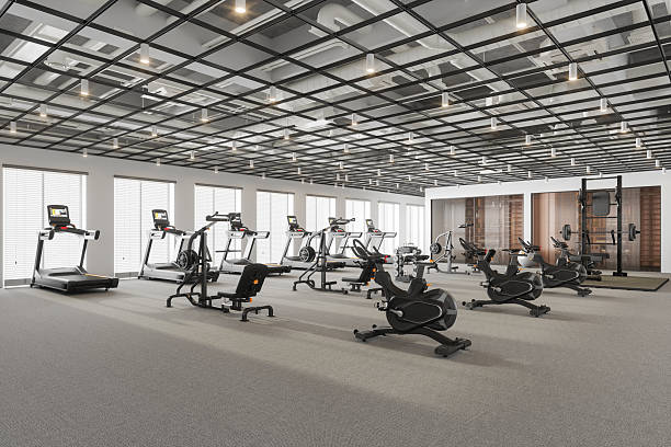 istock Modern Empty Gym Interior with Exercise Machines and Fitness Equipment 2242509580