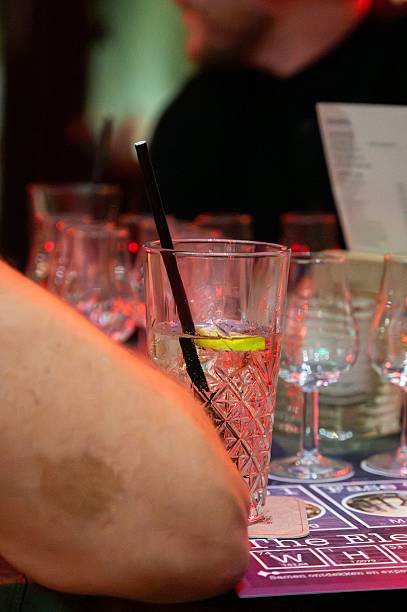istock Tall glass with lemon slice and straw 2242512099