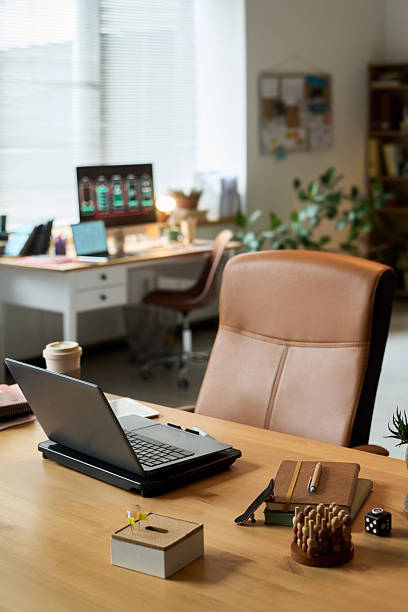 istock Empty Modern Office Workspace Featuring Laptop and Stationery on Desk 2242515103
