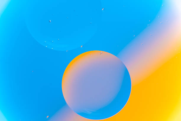 istock Blue and Yellow Abstract Fluid Macro Background with Small Bubbles 2242516399