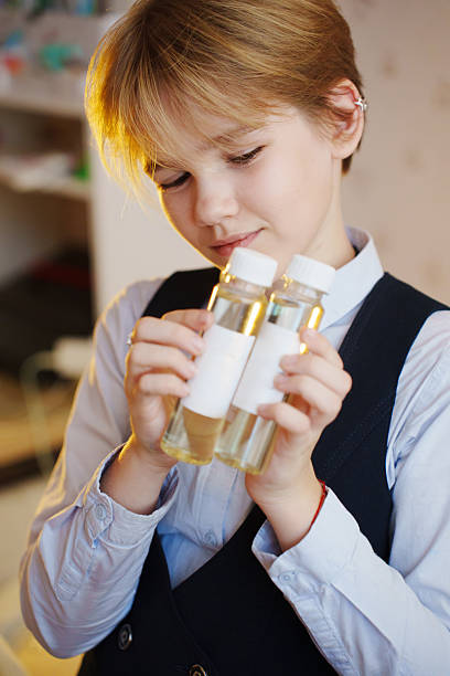 istock Boy examines essential oil bottles for aroma diffuser use at home 2242516919