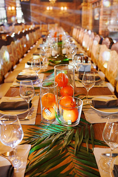 istock Elegant dinner setting with tropical decorations and fresh fruits 2242517342