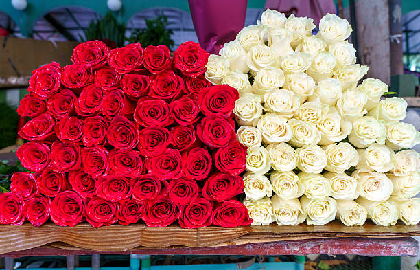 Red and White Roses on Flower Market Table. High quality photo