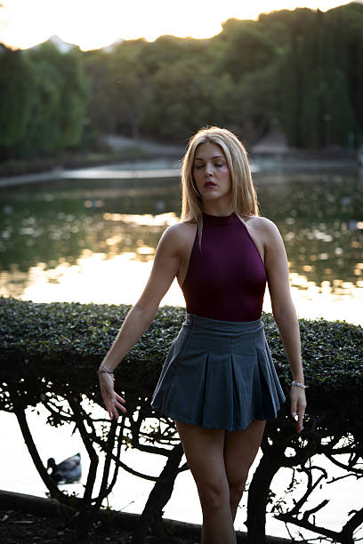 istock Young woman dancing ballet outdoors in park 2242519949