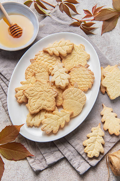 istock Autumn leaf and acorn cookies with honey 2242522361