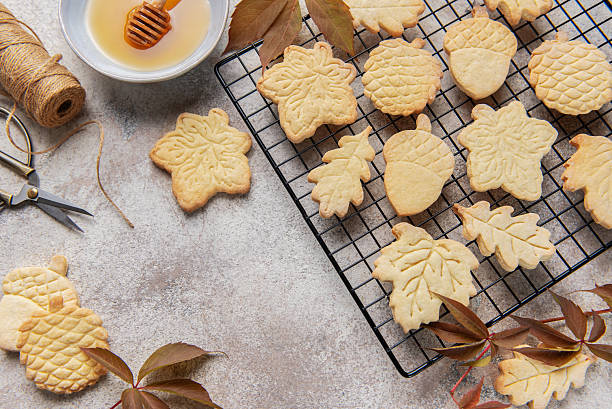 istock Autumn cookies on wire rack with honey and leaves 2242522370