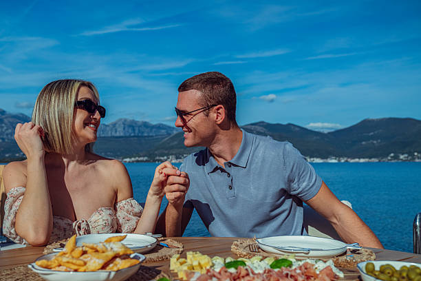 istock Young Couple Enjoying Seaside Brunch on Holiday 2242525247