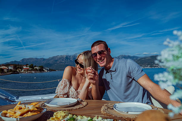 istock Young Couple Enjoying Seaside Brunch on Holiday 2242525248