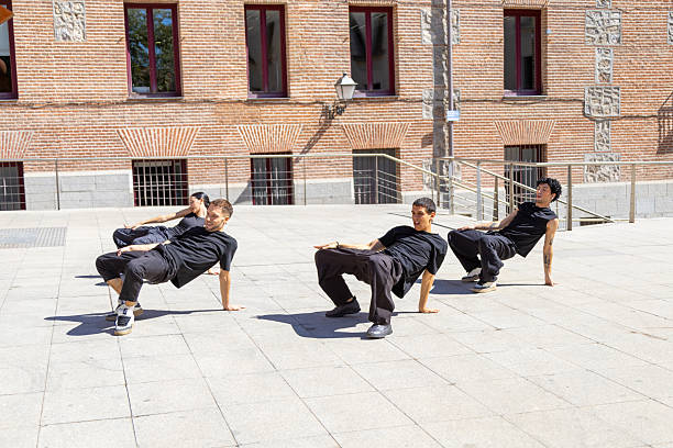 istock Street dancers performing synchronized choreography in plaza 2242525263