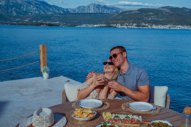 istock Young Couple Enjoying Seaside Brunch on Holiday 2242525420