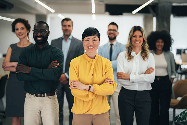 istock Confident female leader with diverse business team in modern office 2242528193