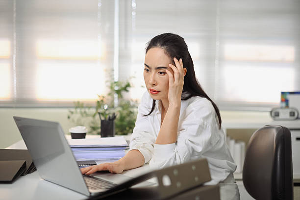 istock Tired Business woman in office 2242530788