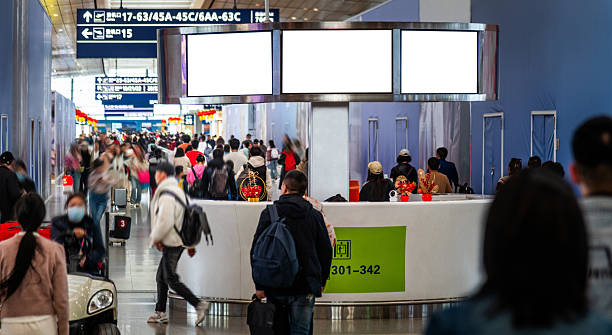 istock Motion blur of crowded commuters walking at airport terminal boarding gate 2242533017