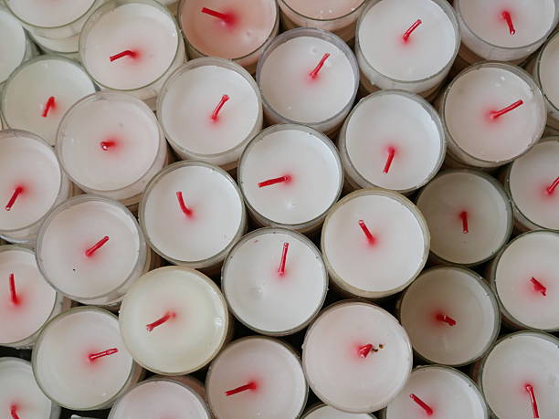 White sacrificial candles symbolize prayer and intercession, remembrance and commemoration, gratitude and offering