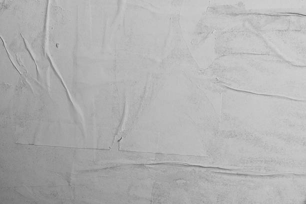 Background of blank white crumpled papers on the wall