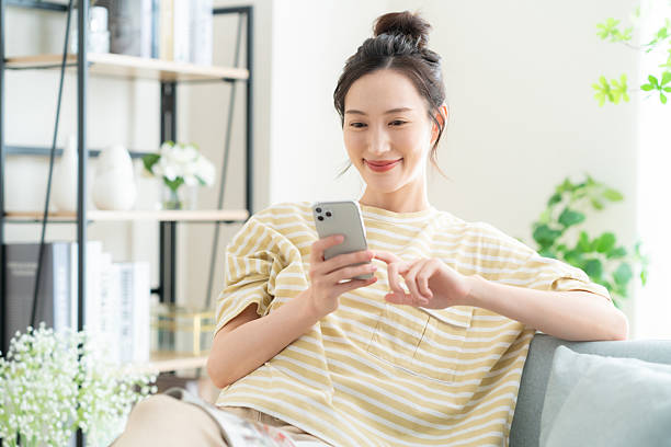 istock woman looking at smartphone 2242533504