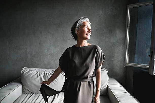 Mature woman smiling, looking away with hope