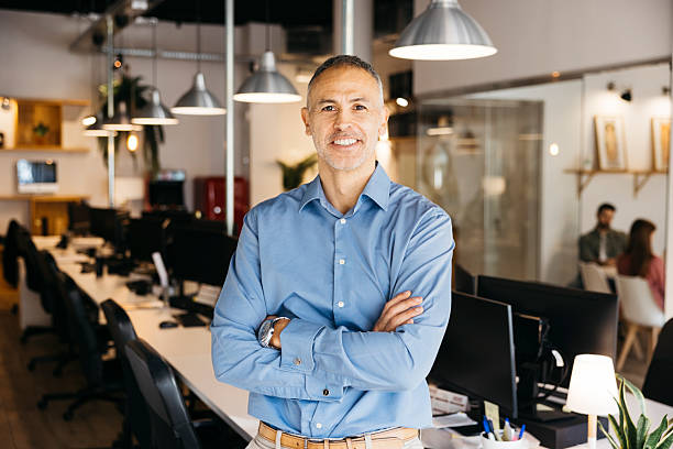 istock Mature businessman standing confidently in modern office 2242538502