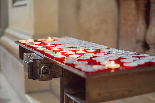 istock Prayer candles inside a Catholic church. 2242541674