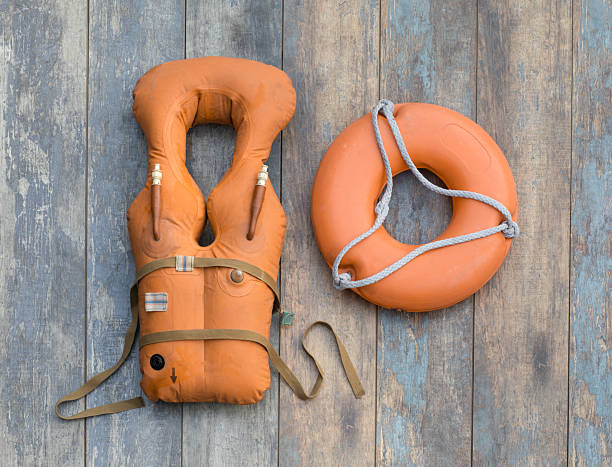 orange life jacket on wooden background