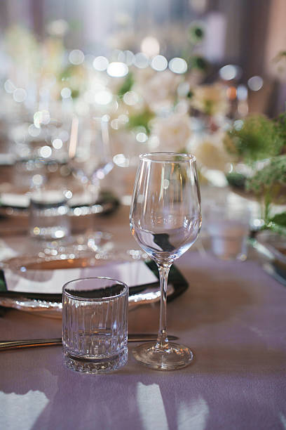istock Stylish dining setup with elegant glassware and floral decorations 2242543282