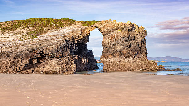 istock Rock arches on Las Catedrales Beach, Galicia 2242543662