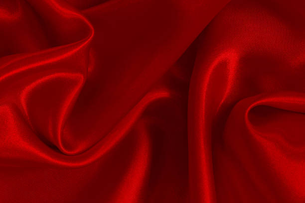 istock Dark red fabric texture background, detail of silk or linen pattern. 2242546276