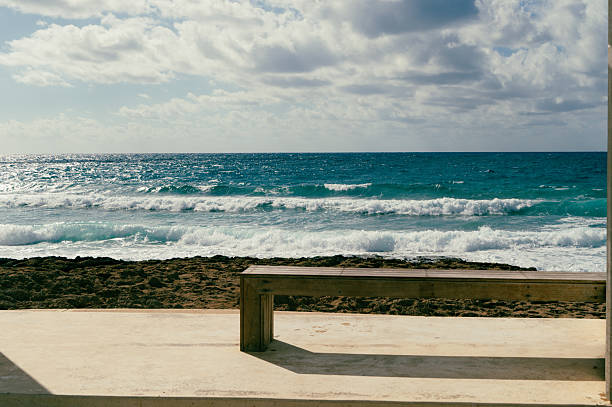 This picturesque and peaceful coastal scene features gentle waves along with a truly serene atmosphere