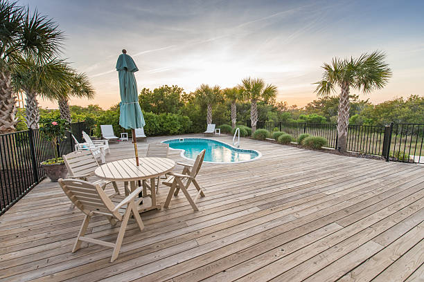Sunrise photos of a beach house and outdoor swimming pool