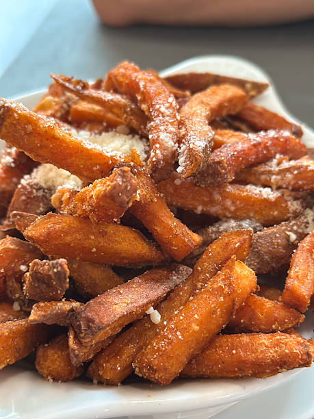 istock Crispy Sweet Potato Fries with Cheese 2242554760