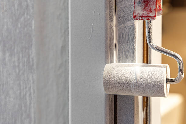 istock Painting Door Frame with Small Roller  Home Renovation in Progress 2242557837