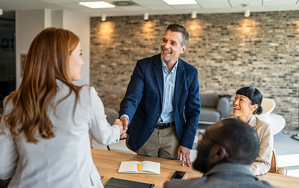 istock Business colleagues shaking hands during office meeting 2242557992