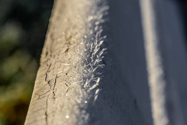 Frost crystals covering a wooden bench - macro photograph