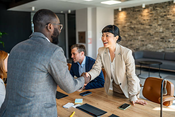 istock Business partners shaking hands after successful agreement 2242558571
