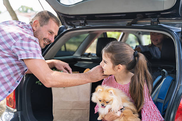 istock Family Returning from Shopping with Pet and Smiles 2242559809