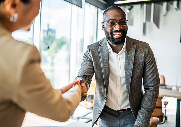 istock Diverse business people shaking hands making a deal 2242560064