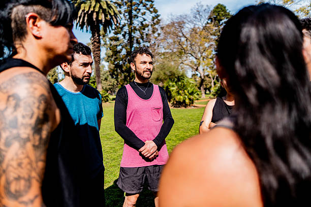 Athlete friends talking at public park