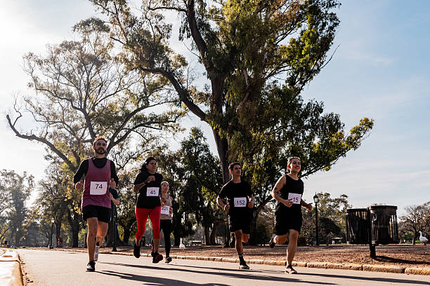 istock People running during marathon on public park 2242560832