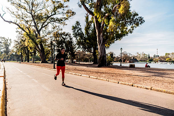 istock Mature woman running on public park 2242561506