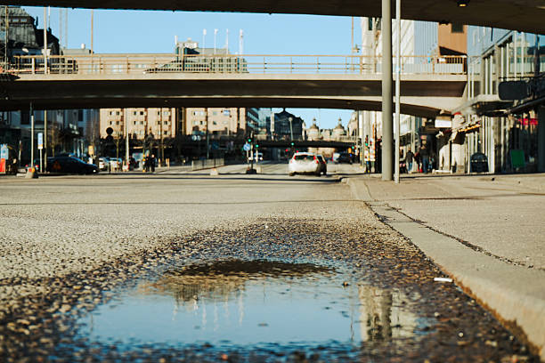 istock Close up of a puddle on street 2242564015