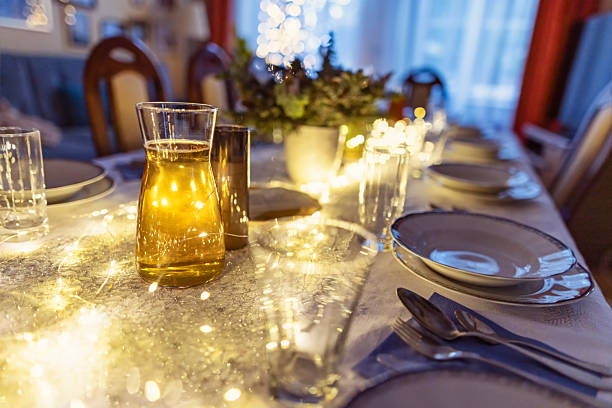 Christmas Eve table, decorated for supper with string lights and pine arrangements.Shot with Canon R5