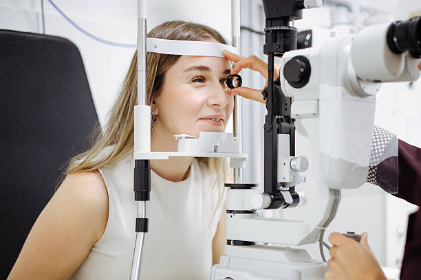 istock Beautiful  woman during her annual eye test check-up 2242566848