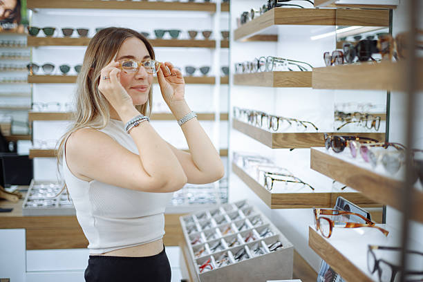 istock Woman selecting eyeglasses in optical store 2242566868