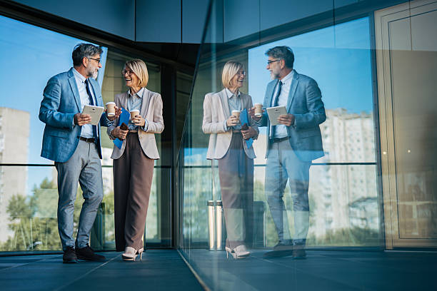istock Business colleagues networking during a coffee break outdoors 2242567505