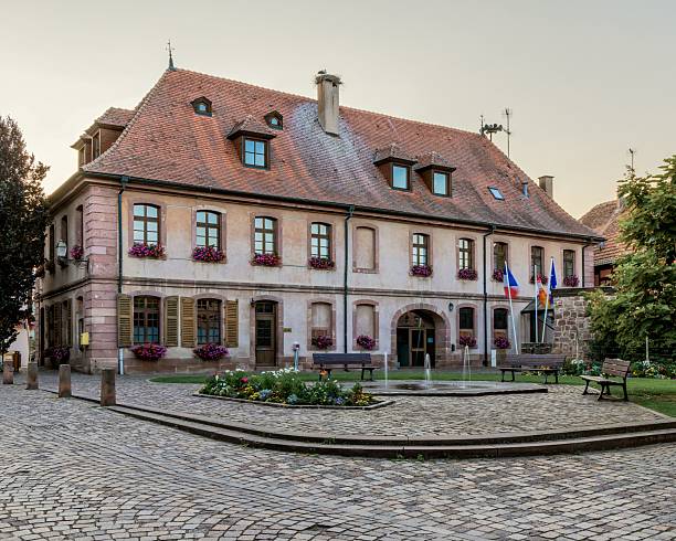 istock Charming historic building with flower-adorned windows. 2242568588