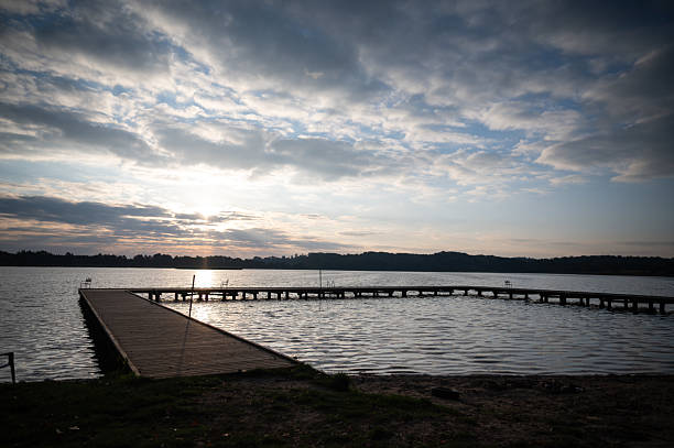 istock Sunset over the lake with a pier 2242569807