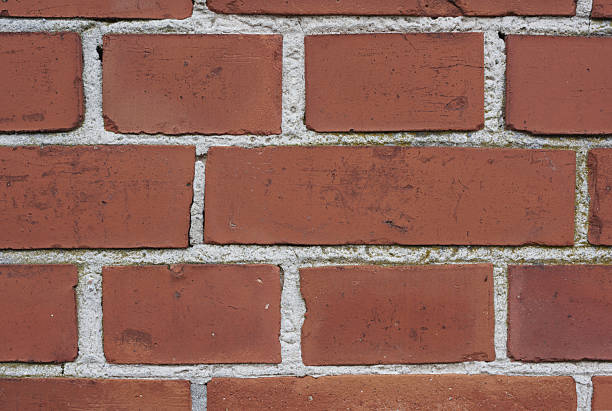 istock Close-up Textured Brick Wall with Rustic Red-Toned Bricks in Detailed Masonry Format 2242570857