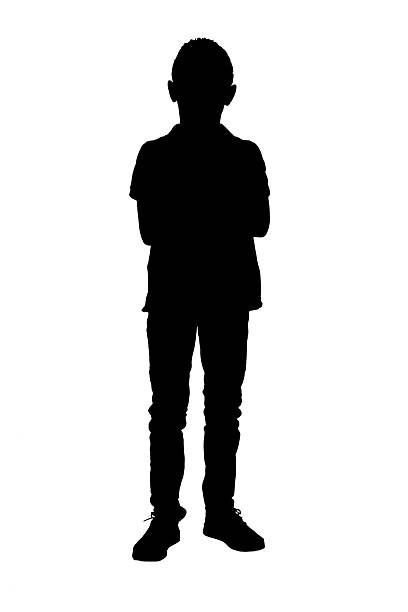 istock silhouette of front view of boy looking at camera, arms crossed on white background 2242573803